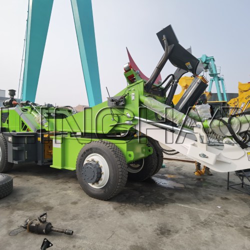 4m³ self-loading concrete mixer truck being carefully loaded into shipping container at SanqGroup yard on February 6, 2026